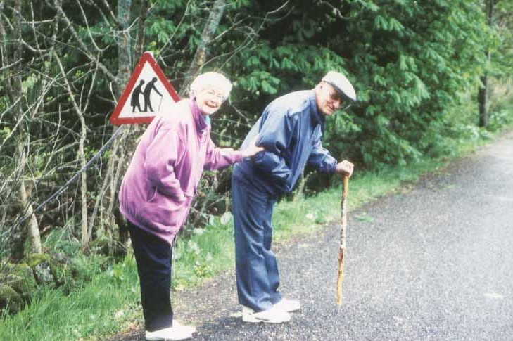 mom and dad imitating elderly sign